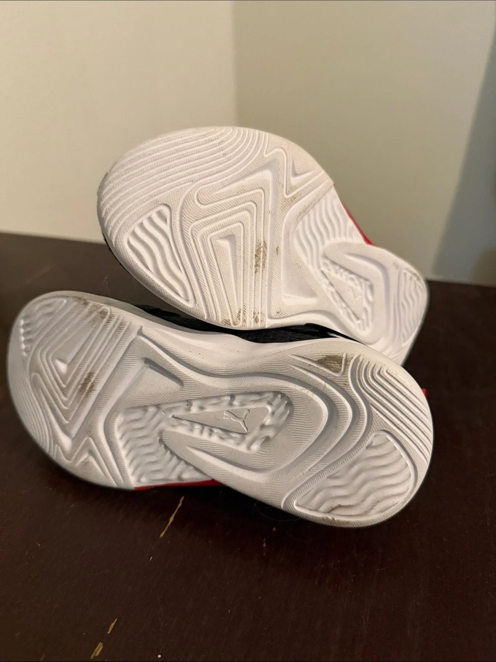 Puma Kids Black Sneakers with Red Accents and White Sole
